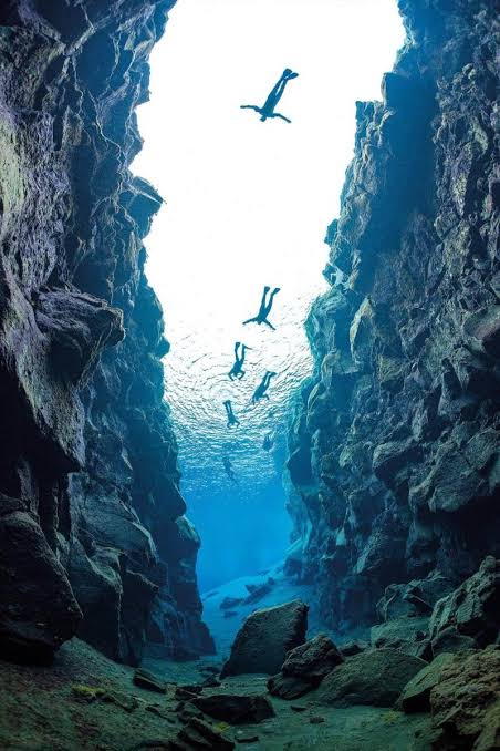 Divers above the Silfra fissure in Iceland